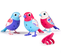 A set of three blue, pink, and purple DigiBirds next to a pink whistle.