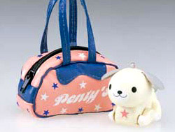 A white dog with a pink star sitting next to a cute tote with the word Penty's on it.
