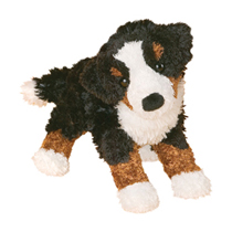 A fuzzy tri-colored dog plush.