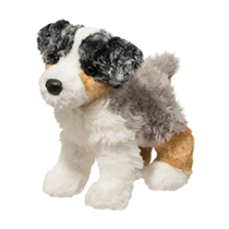 A fluffy plush dog with a stubby tail.