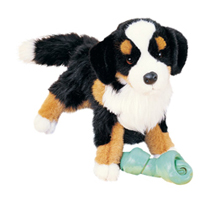 A tri-colored dog plush with a chew joy.