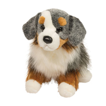 A grey, white, and brown fluffy dog plush.