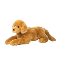 A large golden retriever plush laying down.