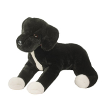 A black and white dog plush with short fur.