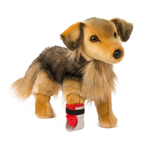 A cute brown dog plush with a brace on it's leg.