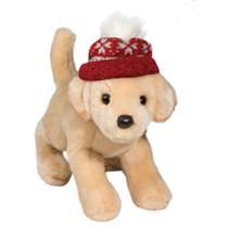 A yellow lab plush wearing a red wintry hat.