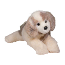 An adorable light colored dog plush.