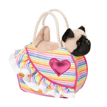 A little pug in a pink carrying sack with a heart on it.