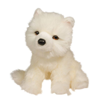 A really fluffy white dog plush with a black nose.