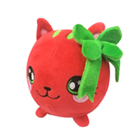 A round red cat plush with a big green bow.