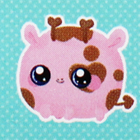 A round pink giraffe plush.